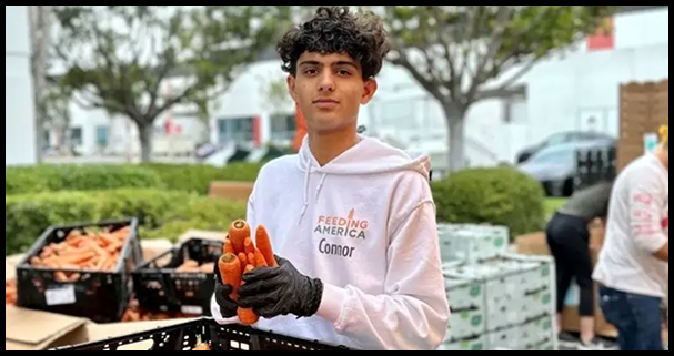 Connor holding produce